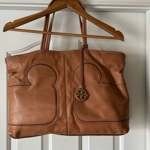 Tory Burch tan pebbled leather tote with canvas lining and a medallion accent